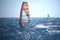 Windsurfer at the Atlantic ocean sparkling in the sun, in back light