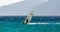 Windsurfer on the background of high mountains rides on the waves of the Red Sea in Egypt Dahab South Sinai