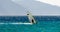 Windsurfer on the background of high mountains rides on the waves of the Red Sea in Egypt Dahab South Sinai