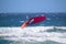 Windsurfer during a jump called backloop over the waves of the Atlantic Ocean, Tenerife, Spain