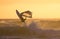 Windsurfer jump sunset