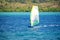 Windsurfer planing in the green and blue water of the bay of Fort-de-France Trois Ilets, Martinique