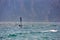 Windsurfer pro-rider surfing at high speed on Lake Garda, italy