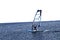 Windsurfer quickly glides over the blue sea. There is a place for text.