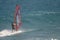 Windsurfer sailing in the sea.