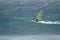 Windsurfer sailing at sea.