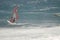 Windsurfer sailing in the sea.