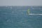 Windsurfer sailing in the sea.