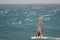 Windsurfer sailing in the sea.