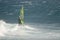 Windsurfer sailing in the sea.