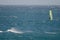 Windsurfer sailing in the sea.