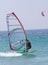 Windsurfer on sunny Tarifa beach in southern Spain