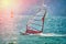 Windsurfer Surfing The Wind On Waves In Garda Lake, Recreational Water Sports, Extreme Sport Action. Recreational Sporting