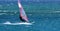 Windsurfer travelling at speed on the Ocean.