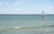 Windsurfers. kiteboarders on choppy sea, background