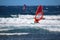 Windsurfers riding the waves of the Atlantic ocean