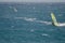 Windsurfers sailing in the sea.