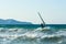 Windsurfers in the sea on Crete on sunset. Windsurfing in Heraklion