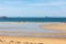 Windsurfers surfing along the beach in Saint Malo. Brittany, France