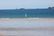 Windsurfers surfing along the beach in Saint Malo. Brittany, France