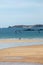 Windsurfers surfing along the beach in Saint Malo. Brittany, France