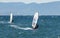 Windsurfers on the waves of the Amur Bay on a cold windy autumn day