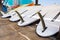 Windsurfing boards storage on a beach watersports facility. Stocked boards