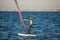 Windsurfing close to the town of Anapa. Performing various tricks on a windsurf when sliding on an sea