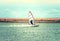 Windsurfing Sport sailing water active leisure Windsurfer on lake summer day