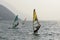 Windsurfs in strong wind in Garda waters, Torbole, Italy