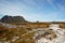 Windswept hikers on the desolate Overland Trail, Tasmania