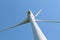 Windturbine against clear blue sky