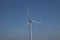 Windturbine in close-up with blue sky as background in the Netherlands