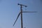 Windturbine in close-up with blue sky as background in the Netherlands.