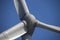 Windturbine in close-up with blue sky as background in the Netherlands..