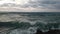 Windy chopy sea with splashing waves in Crete Tsalos Beach