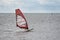 On a windy day many people take the opportunity to do watersports. Windsurfers gather near Lomma beach to practice their