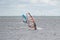 On a windy day many people take the opportunity to do watersports. Windsurfers gather near Lomma beach to practice their