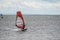 On a windy day many people take the opportunity to do watersports. Windsurfers gather near Lomma beach to practice their