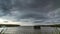 Windy day with storm clouds above the lake