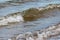 Windy Scene of Small Waves on an incoming Tide