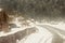 Windy snowy foggy slippery muddy flat step himalayan mountain road in winter. Leh Manali Highway, Jammu and Kashmir, India, Asia