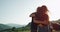 In a windy summer time couple arrived with their motorcycle in amazing place with a beautiful landscape.