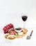 Wine appetizer set. Glass of red, grapes, parmesan