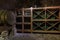 Wine barrel and bottles in wine cellar in Mir castle. Mir, Grodno region, Belarus