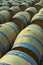 Wine barrels in the antique cellar. Cavernous wine cellar with stacked oak barrels for maturing red wine.