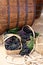 Wine barrels and baskets of grapes