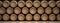 Wine barrels stack on wooden floor, black background. 3d illustration