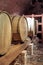 Wine barrels stacked in the cellar. Wine barrels in wine-vaults in order