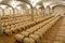 Wine barrels stacked in the cellar of the winery.